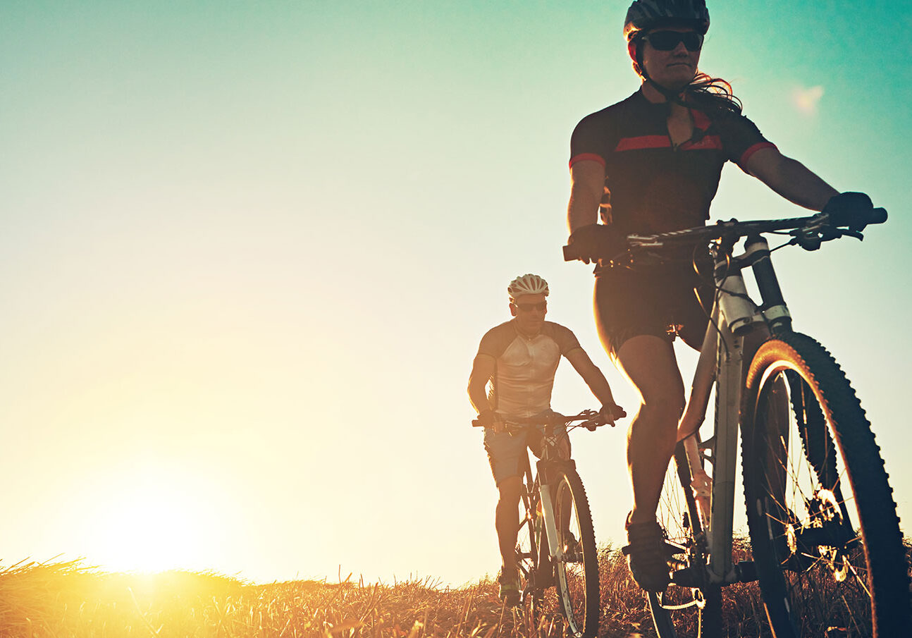 mountain-bikers-with-sun