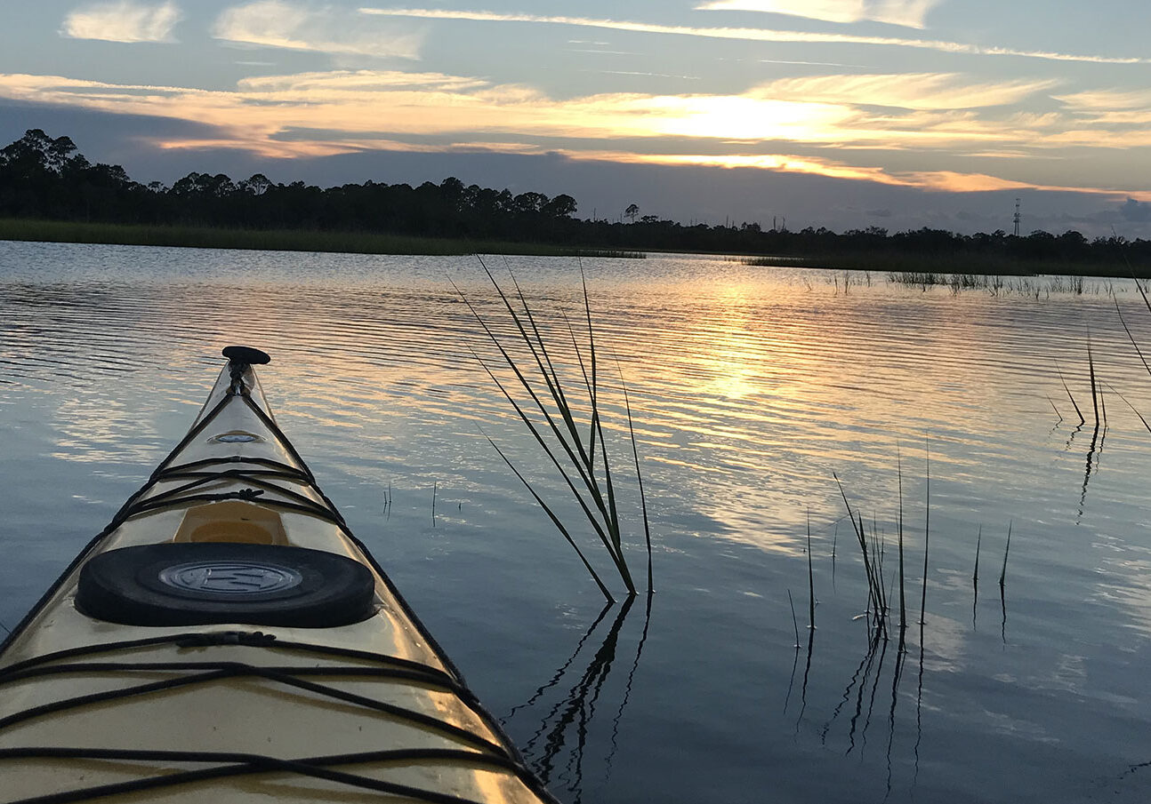 tip-of-kayak-at-sunser-horizontal-Kelly